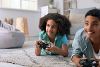 Teenager playing computer game