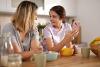 Teen and lady facing each other at home
